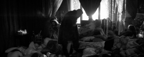 Fig 21 - Ron Perlman in a pile of nude women