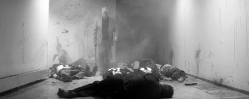 Fig 23 - Ron Perlman in a pile of dead bodies